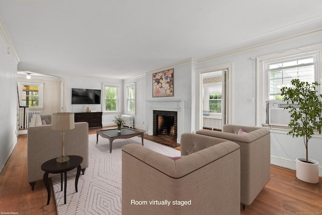 28 Wardwell Rd, West Hartford, CT 06107 - living room featuring ornamental molding, wood finished floors, healthy amount of natural light, a fireplace, and cooling unit