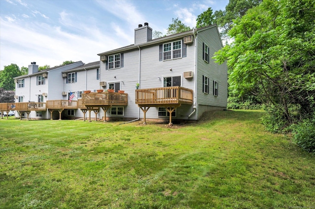 745 Merrow Rd Apt 157, Coventry, CT 06238 - rear view of house featuring a chimney, a lawn, and a wooden deck