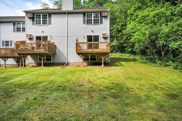 745 Merrow Rd Apt 157, Coventry, CT 06238 - back of property with a chimney, a yard, and a wooden deck