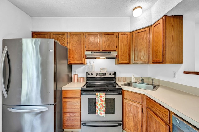 745 Merrow Rd Apt 157, Coventry, CT 06238 - kitchen featuring stainless steel appliances, under cabinet range hood, a sink, light countertops, and a textured ceiling