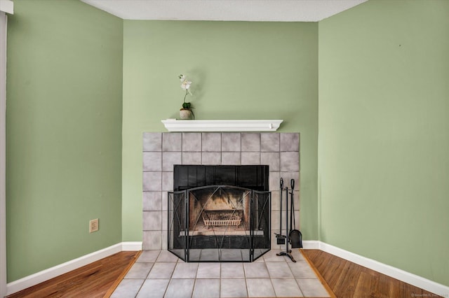 745 Merrow Rd Apt 157, Coventry, CT 06238 - detailed view of a fireplace, baseboards, and wood finished floors