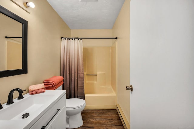 745 Merrow Rd Apt 157, Coventry, CT 06238 - bathroom with toilet, vanity, wood finished floors, baseboard heating, and shower / bath combo with shower curtain