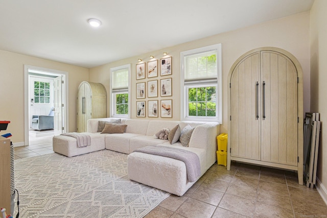 958 Essex Rd, Westbrook, CT 06498 - living room featuring light tile patterned floors and baseboards
