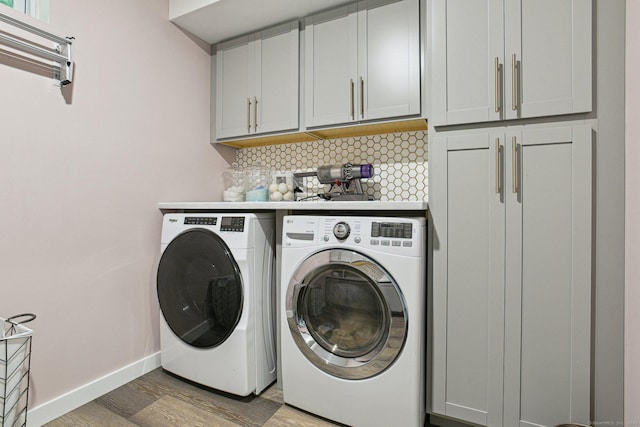958 Essex Rd, Westbrook, CT 06498 - laundry area featuring independent washer and dryer, cabinet space, and light wood-type flooring