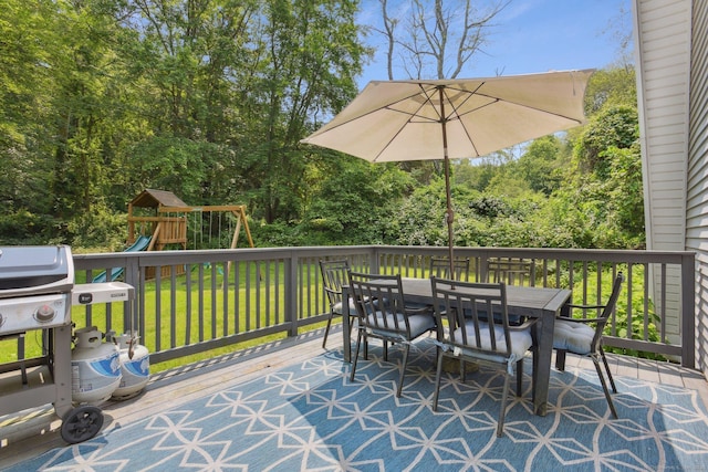 958 Essex Rd, Westbrook, CT 06498 - view of patio / terrace with outdoor dining area, a deck, a playground, area for grilling, and a view of trees