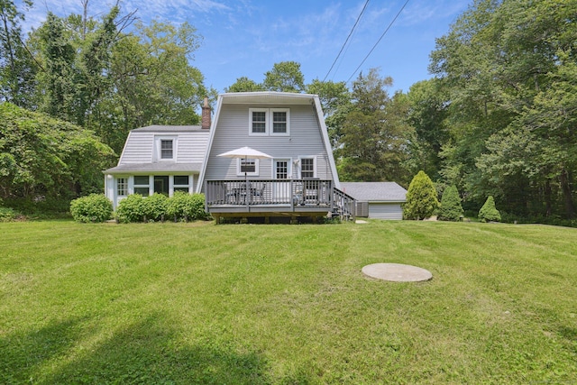 958 Essex Rd, Westbrook, CT 06498 - rear view of house featuring a gambrel roof, a chimney, a lawn, and a wooden deck