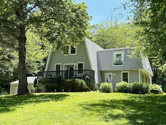 958 Essex Rd, Westbrook, CT 06498 - view of front facade featuring a gambrel roof, a wooden deck, and a front yard