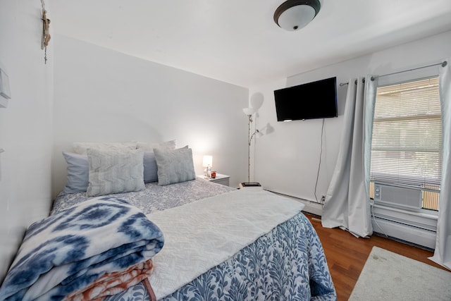 60 Albert St, Torrington, CT 06790 - bedroom featuring a baseboard heating unit and wood finished floors