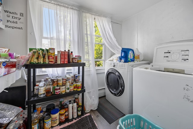 60 Albert St, Torrington, CT 06790 - laundry area with independent washer and dryer, healthy amount of natural light, wood finished floors, and baseboard heating