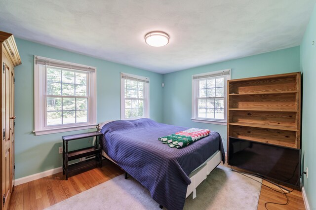 52 N Grand St, Suffield, CT 06093 - bedroom featuring wood finished floors and baseboards