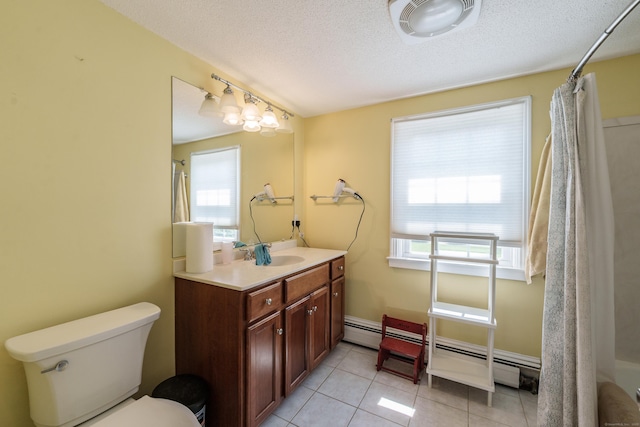 52 N Grand St, Suffield, CT 06093 - bathroom featuring vanity, toilet, plenty of natural light, tile patterned flooring, and a textured ceiling