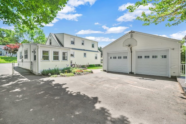 23 Charter Rd, Ellington, CT 06029 - view of front facade featuring a gate, an outbuilding, and a detached garage
