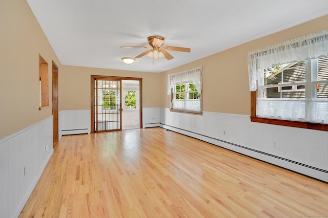 23 Charter Rd, Ellington, CT 06029 - empty room with wainscoting, a baseboard heating unit, light wood-style floors, and ceiling fan