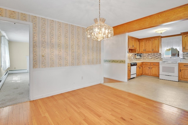 23 Charter Rd, Ellington, CT 06029 - kitchen with white appliances, wainscoting, a chandelier, light countertops, and light wood-style floors
