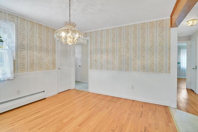 23 Charter Rd, Ellington, CT 06029 - unfurnished dining area with baseboard heating, a chandelier, hardwood / wood-style flooring, crown molding, and a wainscoted wall