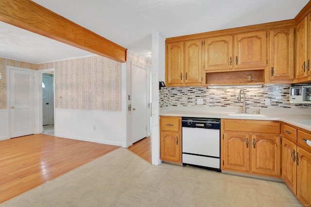 23 Charter Rd, Ellington, CT 06029 - kitchen featuring dishwasher, a sink, wainscoting, light countertops, and wallpapered walls