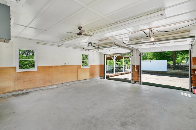 23 Charter Rd, Ellington, CT 06029 - garage with a garage door opener and a wainscoted wall