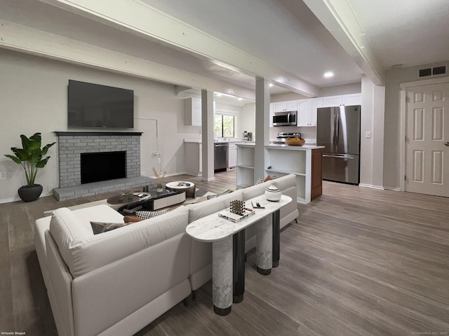 8 Highpoint Ct Unit 8, Woodbury, CT 06798 - living room with light wood-style flooring, baseboards, recessed lighting, and a fireplace