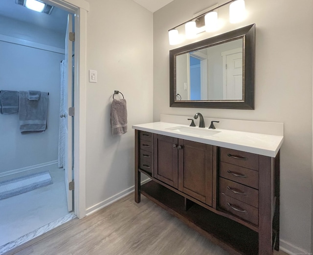 8 Highpoint Ct Unit 8, Woodbury, CT 06798 - full bathroom with wood finished floors, vanity, and baseboards