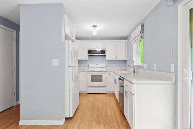 30 Seymour Rd Apt D3, Plymouth, CT 06786 - kitchen with stainless steel appliances, light wood-style flooring, light countertops, and white cabinetry