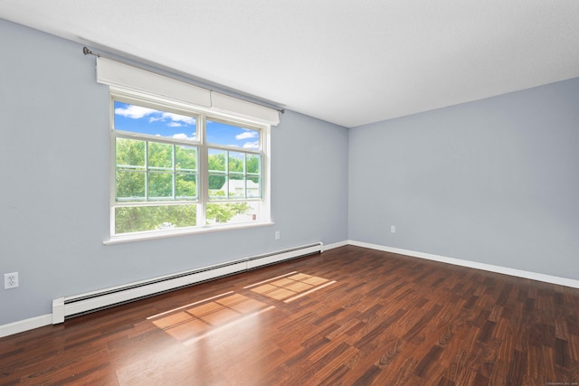 30 Seymour Rd Apt D3, Plymouth, CT 06786 - empty room featuring baseboard heating, healthy amount of natural light, and dark wood-style flooring