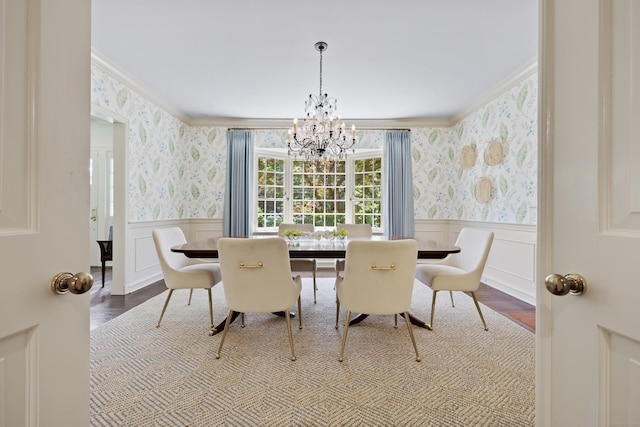 66 Stanton Rd, Darien, CT 06820 - dining room featuring wallpapered walls, ornamental molding, a chandelier, wainscoting, and a decorative wall