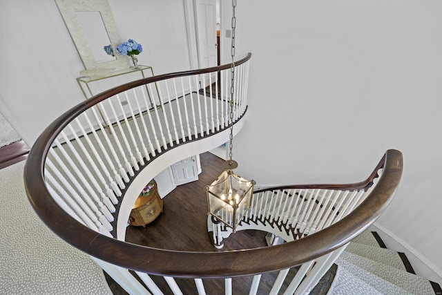 66 Stanton Rd, Darien, CT 06820 - stairway featuring a chandelier and wood finished floors