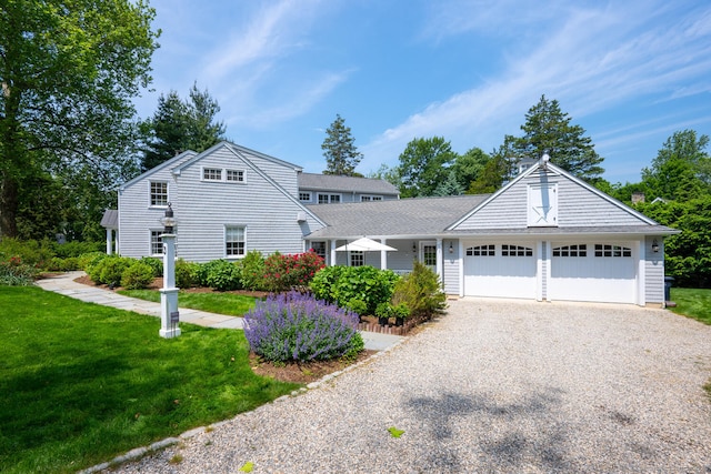 3 Bittersweet Trl, Norwalk, CT 06853 - view of front of house featuring driveway, a front lawn, and a garage