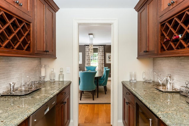3 Bittersweet Trl, Norwalk, CT 06853 - indoor wet bar featuring wine cooler, stainless steel dishwasher, light wood-style floors, and decorative backsplash