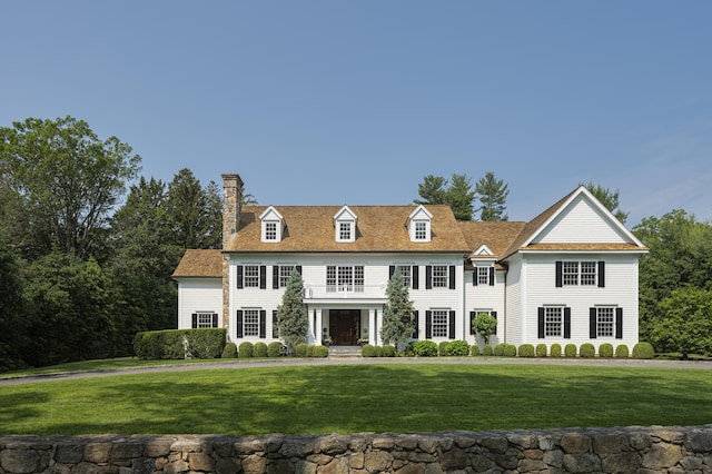 50 Chichester Rd, New Canaan, CT 06840 - view of front of house with a chimney and a front yard