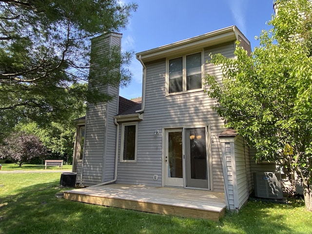 64 Copper Beech Dr Unit 64, Rocky Hill, CT 06067 - rear view of house featuring a chimney, a lawn, a wooden deck, and central air condition unit
