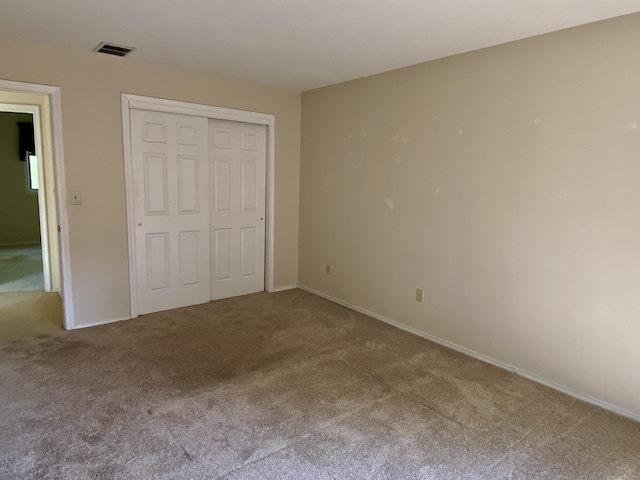64 Copper Beech Dr Unit 64, Rocky Hill, CT 06067 - unfurnished bedroom featuring carpet, a closet, and baseboards