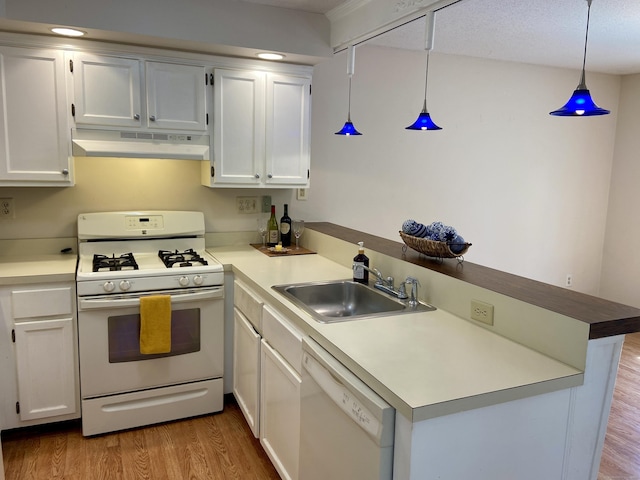 64 Copper Beech Dr Unit 64, Rocky Hill, CT 06067 - kitchen featuring white appliances, under cabinet range hood, a sink, a peninsula, and wood finished floors