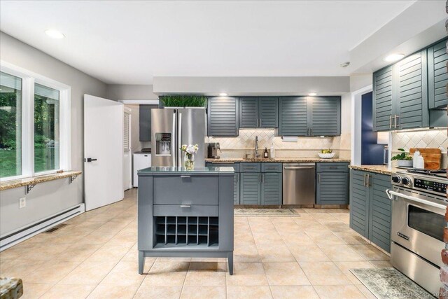 10 Fernbrook Dr, Brookfield, CT 06804 - kitchen featuring stainless steel appliances, decorative backsplash, light stone counters, light tile patterned floors, and recessed lighting