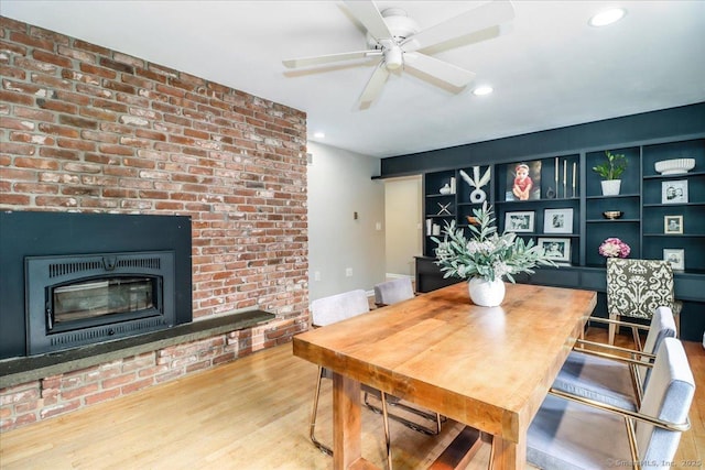 10 Fernbrook Dr, Brookfield, CT 06804 - dining space featuring a brick fireplace, wood finished floors, recessed lighting, and a ceiling fan