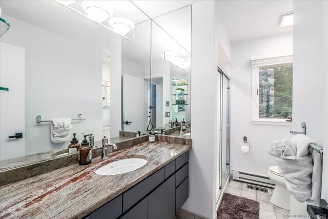 10 Fernbrook Dr, Brookfield, CT 06804 - full bathroom featuring a baseboard heating unit, vanity, a stall shower, and tile patterned floors