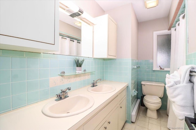 10 Fernbrook Dr, Brookfield, CT 06804 - full bathroom featuring double vanity, tile patterned floors, tile walls, and wainscoting