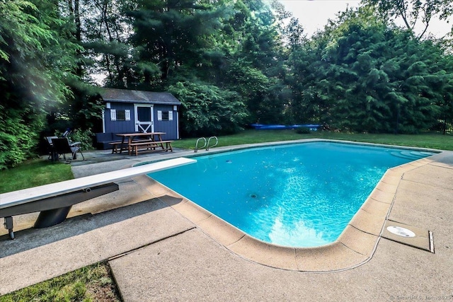 10 Fernbrook Dr, Brookfield, CT 06804 - outdoor pool featuring a diving board, a patio area, an outdoor structure, and view of scattered trees