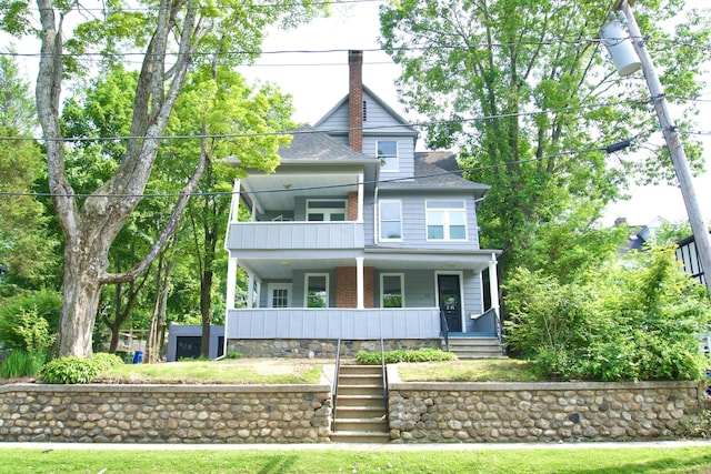 10 Fleming St, Waterbury, CT 06710 - view of front facade with covered porch, roof with shingles, stairs, and a chimney