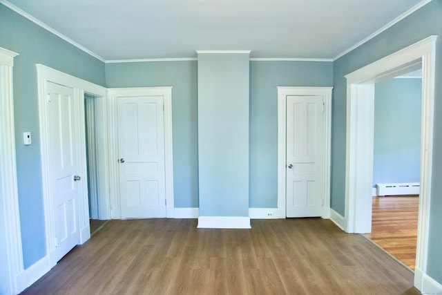 10 Fleming St, Waterbury, CT 06710 - unfurnished bedroom with a baseboard radiator, wood finished floors, baseboards, and ornamental molding