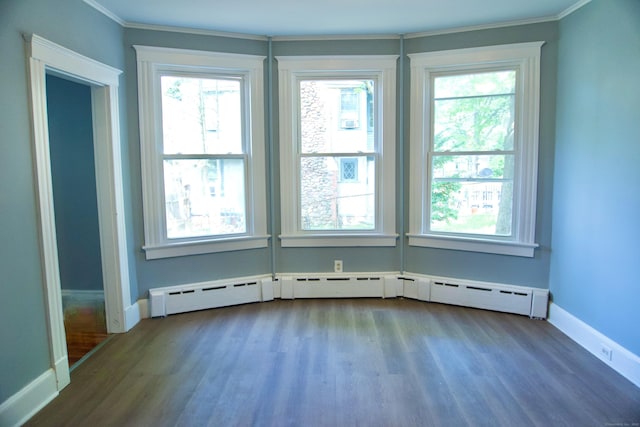 10 Fleming St, Waterbury, CT 06710 - spare room featuring wood finished floors, ornamental molding, baseboards, and a baseboard radiator