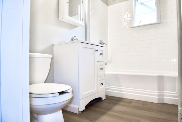 10 Fleming St, Waterbury, CT 06710 - full bath featuring toilet, wood finished floors,  shower combination, and vanity
