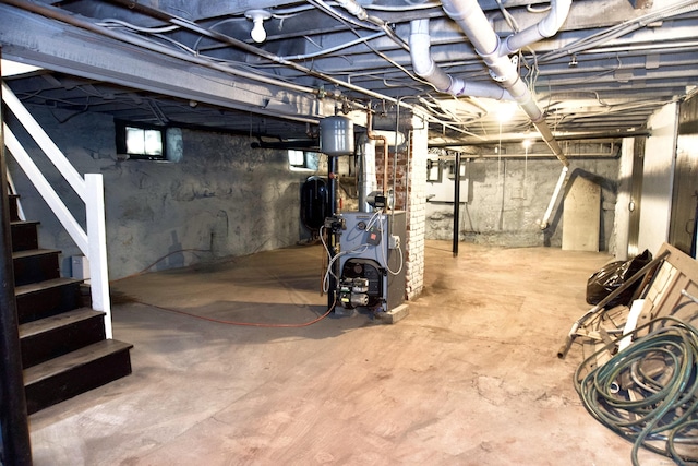10 Fleming St, Waterbury, CT 06710 - basement with a heating unit, oil tank, and stairs