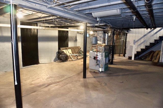 10 Fleming St, Waterbury, CT 06710 - unfinished basement with a heating unit and stairway