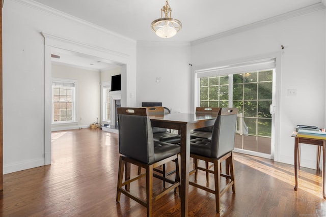 1-1/2 Colony St, Norwalk, CT 06851 - dining room with dark wood-style flooring, baseboards, ornamental molding, and a fireplace