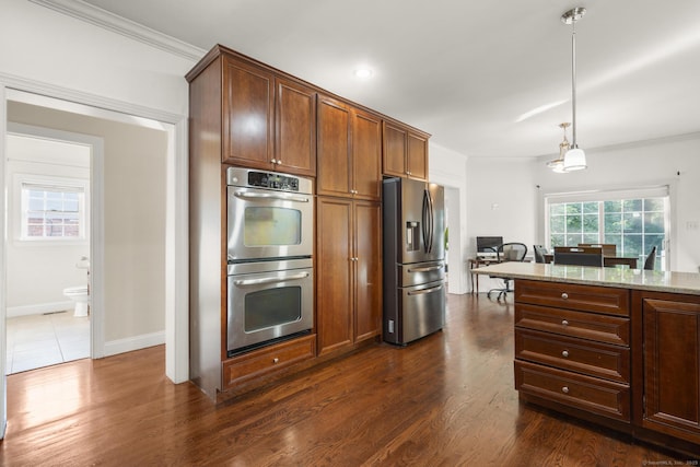 1-1/2 Colony St, Norwalk, CT 06851 - kitchen featuring stainless steel appliances, light stone countertops, decorative light fixtures, dark wood-type flooring, and crown molding