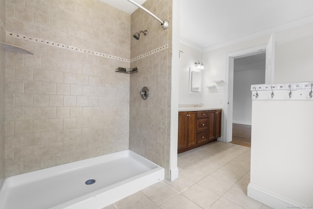1-1/2 Colony St, Norwalk, CT 06851 - bathroom with tile patterned floors, vanity, tiled shower, ornamental molding, and baseboards
