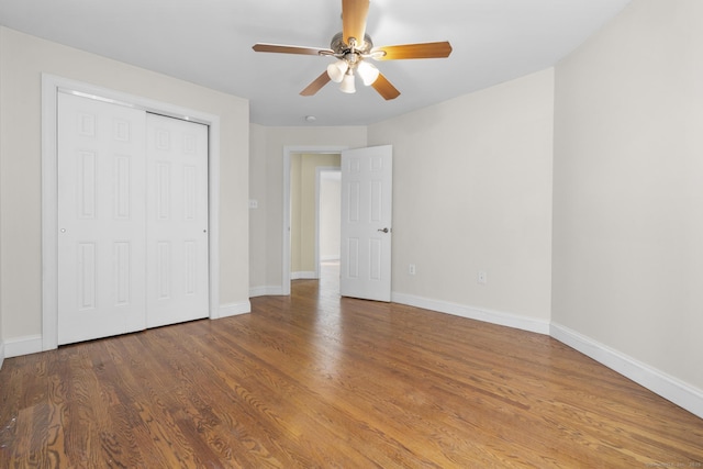 1-1/2 Colony St, Norwalk, CT 06851 - unfurnished bedroom with baseboards, wood finished floors, a closet, and a ceiling fan