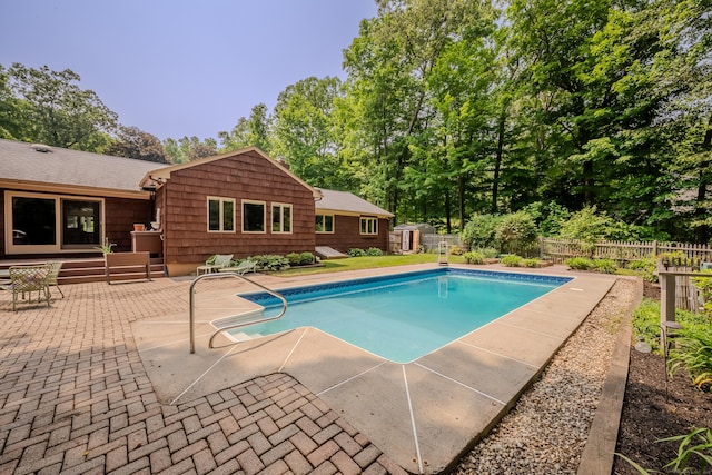 5 Stone Wall Ln, Woodbridge, CT 06525 - view of swimming pool with a patio, a shed, and view of scattered trees