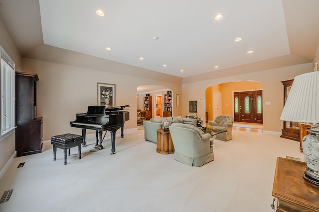 5 Stone Wall Ln, Woodbridge, CT 06525 - living area featuring arched walkways, light carpet, baseboards, recessed lighting, and a raised ceiling